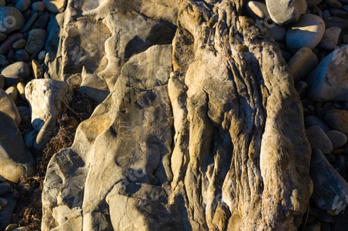 Preview: Boulders And Colorful Pebbles On The Beach On A Warm Summer Day