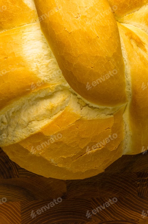 Preview: Fresh Braided Loaf Of White Wheat Bread On Wooden Background