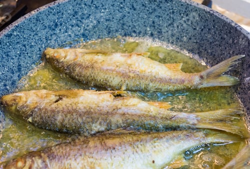 Preview: Fried River Fish With Crispy Crust In A Frying Pan, Homemade Dish, Close Up