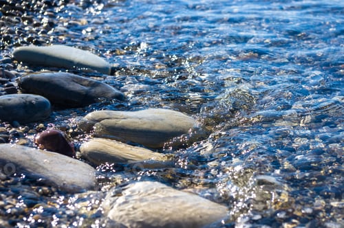 Preview: Sea Pebble Beach With Multicoloured Stones, Transparent Waves With Foam, On A Warm Summer Day