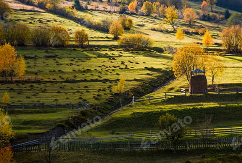 Preview: Haystack Behind The Fence Near The Path On Hillside In Autumn. Beautiful Countryside Scenery With