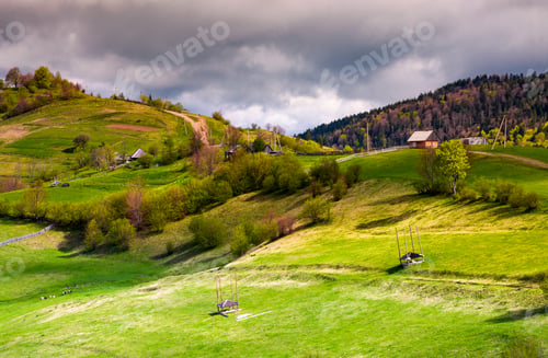 Preview: Wooden Fences Of Rural Area On Grassy Hillsides. Lovely Rural Landscape Of Mountainous Village In