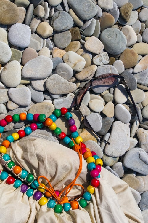 Preview: Beach Bag And Sunglasses On Pebble Beach, Sunset