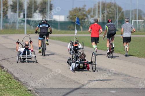 Preview: Disabled Athletes Training With Their Special Bikes With Cyclist And Runners Close To Them.