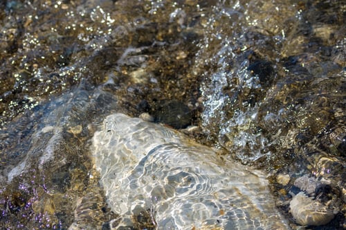 Preview: Pebble Stones On The Sea Beach On A Warm Summer Day, The Rolling Waves Of The Blue Sea With White