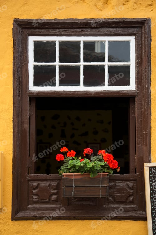 Preview: Old Weathered Wooden Window Frame With Geranium Flower Pot