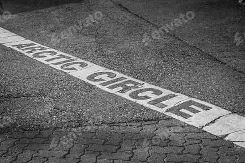 Preview: Arctic Circle Line Sign Strip On The Ground In Rovaniemi, Finland