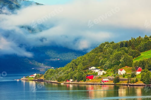 Preview: Norwegian Village Landscape With Fjord, Mountains With Clouds And Colorful Houses, Lighthouse In
