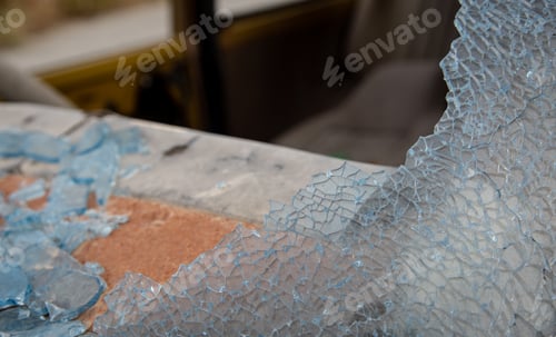 Preview: Broken Blue Crystal Glass Background. Graphic Textures From A Broken Car Front Glass