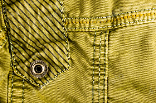 Preview: Clothing Items Stonewashed Cotton Fabric Texture With Seams, Clasps, Buttons And Rivets, Macro