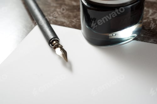 Preview: Nib Pen For Calligraphy And Inkwell On A Table.