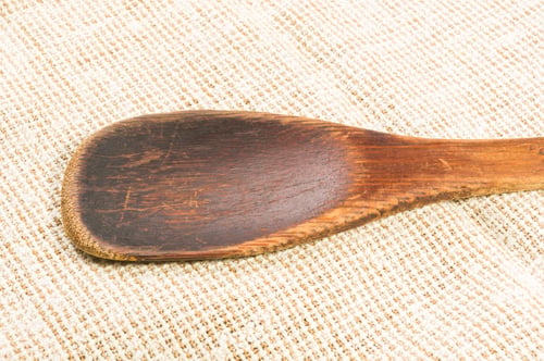 Preview: Rustic Coarse Canvas Fabric And A Worn Wooden Spoon, Close-Up, Background