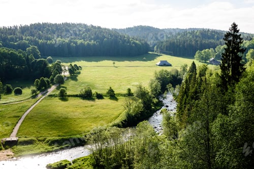 Preview: Beautyful Morning Light Over Forest River Of Amata, Cesis, Latvia. Sandstone Cliffs And Green