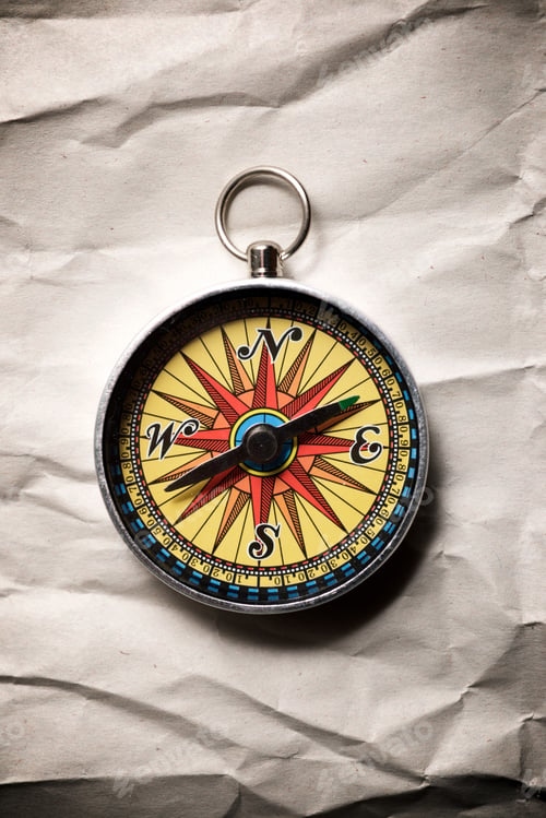 Preview: Close-Up Of A Vintage Compass On A Paper.