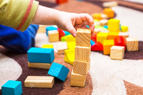 Preview: Small Child Playing With Wooden Blocks. Caucasian Boy Building With Blocks