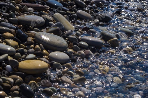 Preview: Sea Pebble Beach With Multicoloured Stones, Transparent Waves With Foam, On A Warm Summer Day