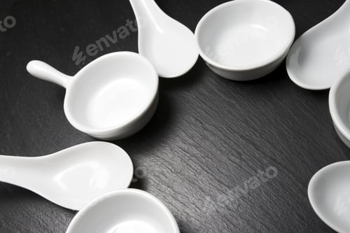 Preview: Small White Spoons On A Table Slate