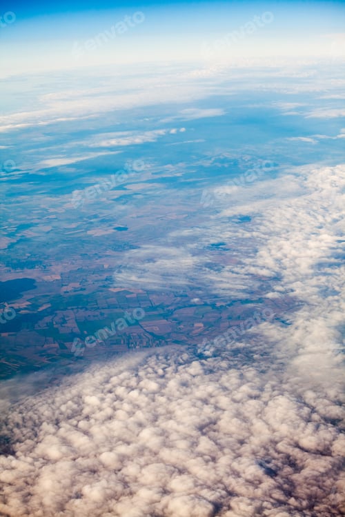 Preview: Expansive Aerial View of Rural Fields and Clouds