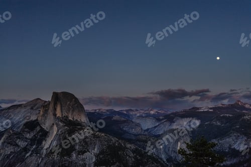 Preview: A Panoramic View Of Half Dome And Yosemite Valley. Golden Light From The Sunset Is Cast Upon The