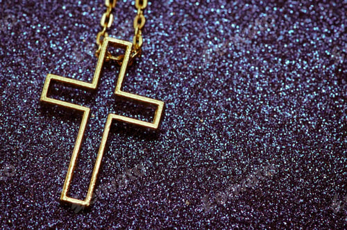 Preview: Golden Cross Symbol Over Purple Background