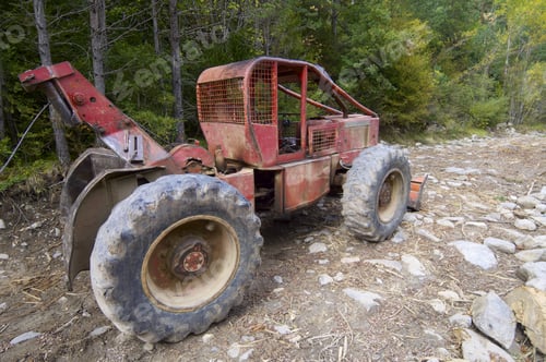 Preview: Closeup Of A Bulldozer Parked In A Forest