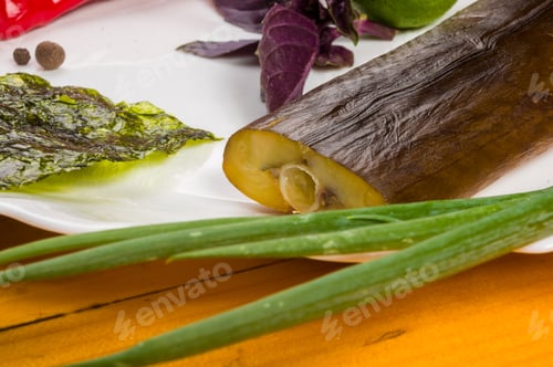 Preview: Smoked Garfish With Lime, Basil, Green Onions, Chili, Nori Chips, Spices, Olive Oil In A White