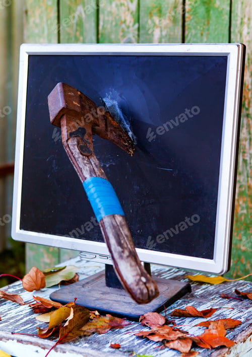 Preview: Axe In A Computer Screen Monitor On The Old Planks Background Outdoor