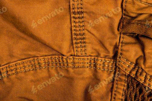 Preview: Clothing Items Stonewashed Cotton Fabric Texture With Seams, Clasps, Buttons And Rivets, Macro