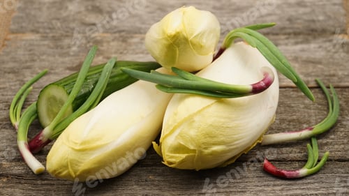 Preview: Endives And Onion Leaves On A Wooden Board