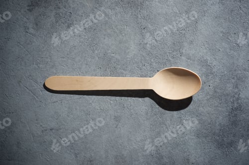 Preview: Disposable Wooden Cutlery On A Stone Table.