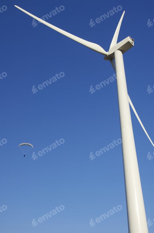 Preview: Paraglide And Wind Mill With Blue Sky