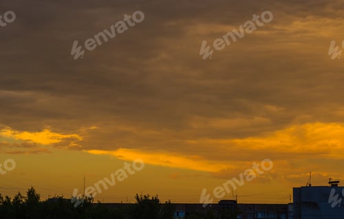 Preview: Landscape With Dramatic Light - Orange Clouds And The Outline Of Trees At Sunset