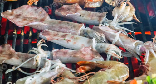 Preview: Grilled Squid Calamari Bbq Seafood Cuisine Barbecue. Flaming Charcoal Grill With Open Fire.