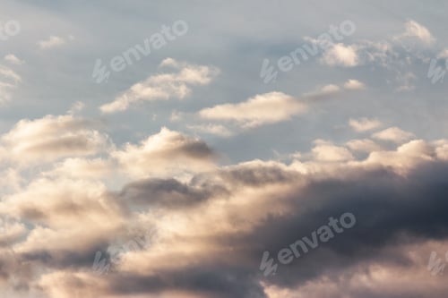 Preview: Beautiful Cloudy Sky At Sunset. Abstract Cloud Formations Colored In To Gold By Sunlight From
