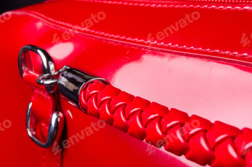 Preview: Closeup Of Buckles, Clasps, Zippers, Pockets, Fasteners, Fittings And Seams On The Red Lacquer Hand