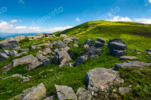 Preview: Huge Rocky Formation On The Grassy Hillside. Beautiful Landscape Of Runa Mountain On A Bright