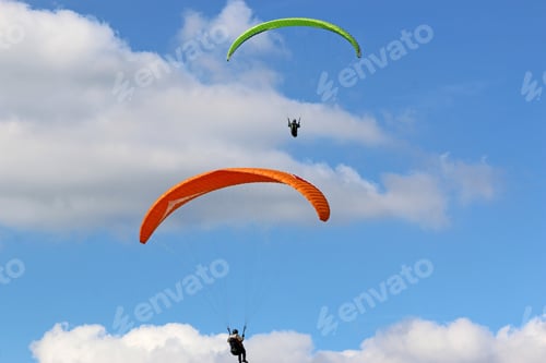 Preview: Paragliders Flying Wing In A Blue Sky