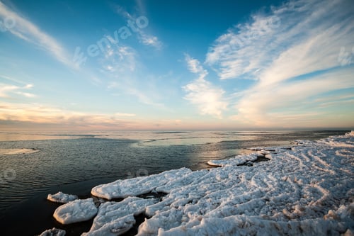 Preview: Frozen Sea Side Beach Panorama In Winter With Lots Of Ice And Snow In Late Evening