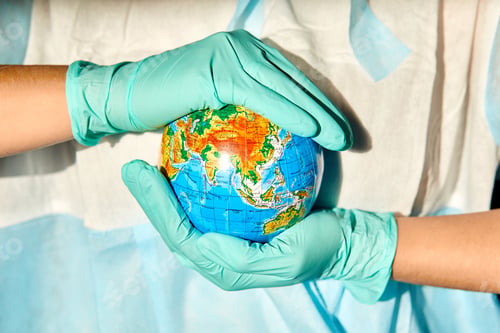 Preview: Globe In The Hands Of The Doctor In Hard Light, Symbol That People All Over Planet Are Quarantined