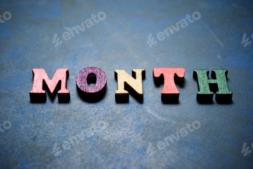 Preview: Month Word On A Blue Table.