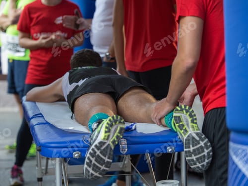 Preview: Man Receives Leg Massage at Outdoor Event