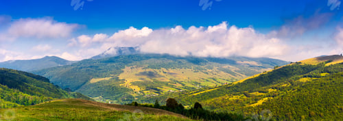 Preview: Panorama Of Mountainous Rural Area In Autumn. Lovely Countryside Scenery With Fluffy Clouds Above