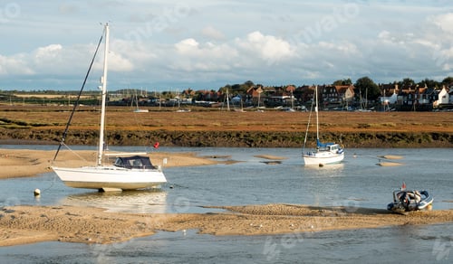 Preview: Coastal Landscape With Small Boats And Town In The Background