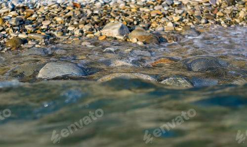 Preview: Pebble Stones On The Sea Beach, The Rolling Waves Of The Sea With Foam