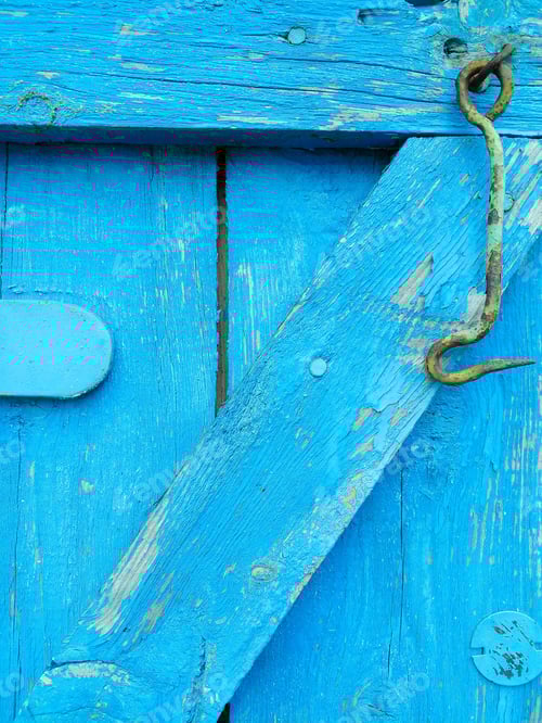 Preview: Close-up of a Rustic Blue Painted Wooden Door