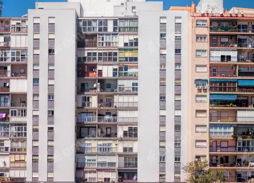 Preview: Frontal View Of A High-Rise Residential Building With Balconies And Awnings