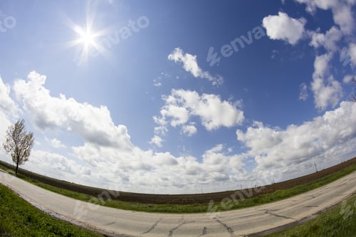 Preview: Rural Landscape With White And Grey Clouds And Wheat Field. Fisheye Lens Effect