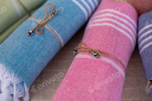 Preview: Rolled Stylish Comfort And Colourful Blankets Stored On Top Of Each Other. Rolled Blankets In A
