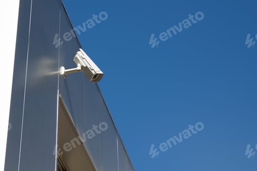 Preview: Closeup Of A Surveillance Camera And Clear Sky.