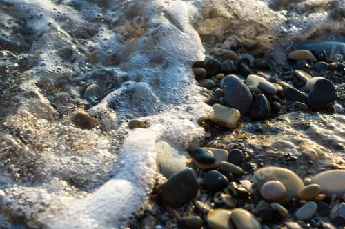 Preview: Pebble Stones On The Sea Beach, The Rolling Waves Of The Sea With Foam